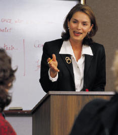 Speaker presenting with confidence at an important business meeting.